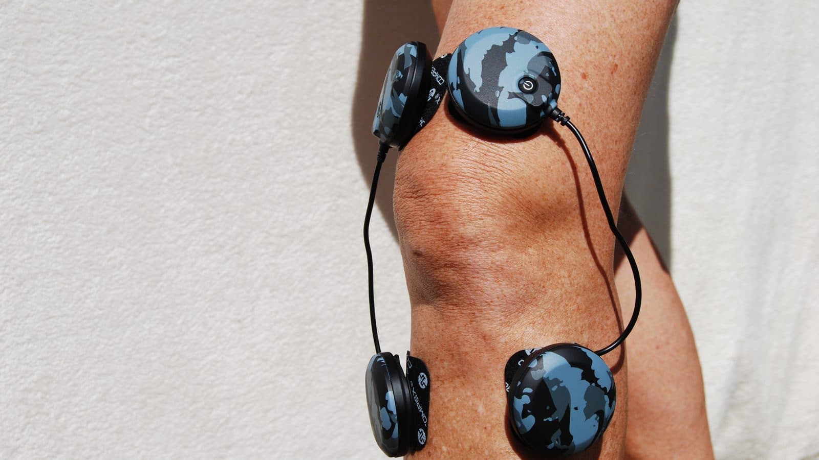 Compex wireless pods positioned above and below the knee