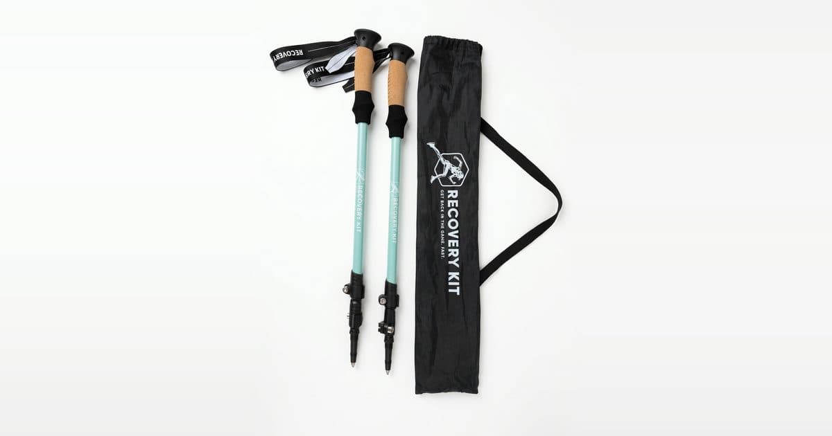 A pair of Recovery Walking Poles beside their Recovery Kit carry case